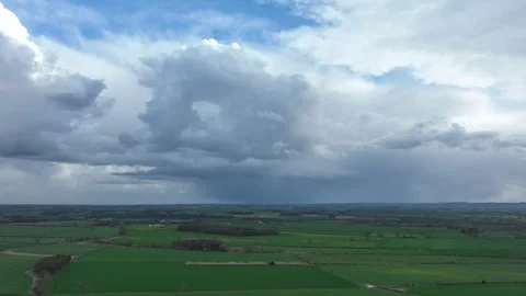 Chasing rain clouds across an open rural landscape Stock-Footage 262895555