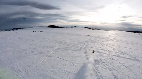 Chasing timbersled into sunset in snowy Big Horn mountains 動画素材 224159683