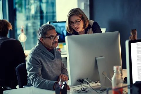 Chasing time to get ahead of their deadlines. a group of businesspeople working Stock Photos