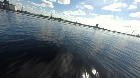 Chasing the Wake Low Flying FPV Pursuit over Water Video stock 306317599