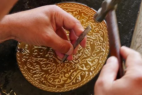 Chasing work on the brass plate Fotos Stock