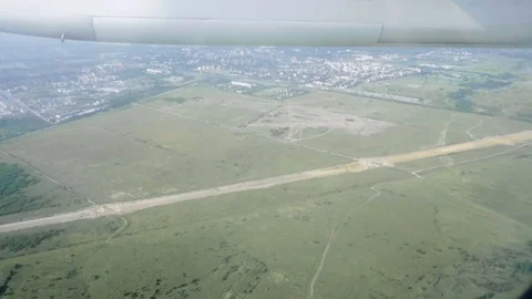 The chassis of the airplane appears from storage place in the the wing Stock Footage 81069133