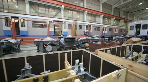 Chassis and elements at workshop with workers in factory Stock Footage 32152026