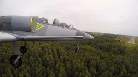 The chassis of training gray blue fighter jet plane is touching the ground. Stock Footage 118676745