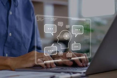 Chat bot,Chat with AI or Artificial Intelligence.Young businessman chatting.. Stock Photos