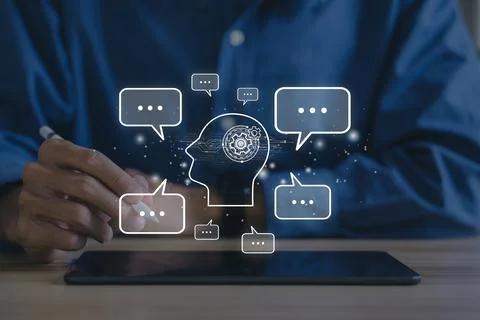Chat bot,Chat with AI or Artificial Intelligence.Young businessman chatting.. Stock Photos
