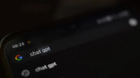 Chat gpt artificial intelligence app type on the phone internet search bar. Video stock 229702683