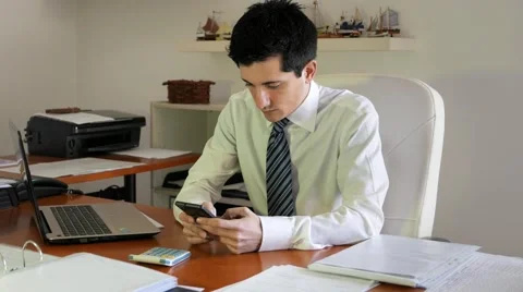 Chat on mobile phones while you are at work Stock Footage 60682771