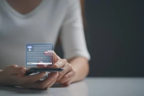 Chatbot, Interactive agent, Female hand holding mobile phone utilizing virt.. Stock Photos