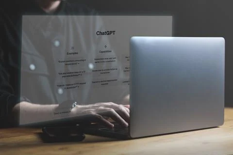 ChatGPT chat window. ChatGPT app on screen hologram from Laptop. Chatting with Stock Photos