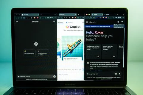 ChatGPT, Gemini, Copilot AI chatbots opened on separated windows on laptop Stock Photos