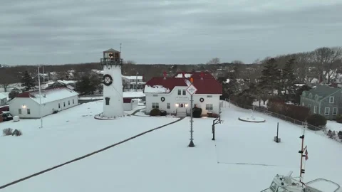 Chatham, Cape Cod Lighthouse in Winter with Snow Aerial Stock Footage 325748592