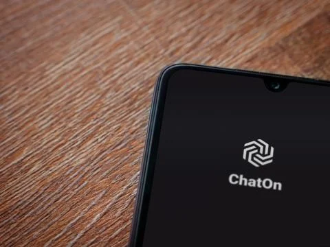 ChatOn app launch screen on smartphone on wooden background Stock Photos