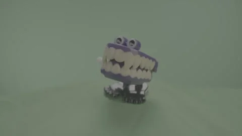 Chattering Teeth Purple | Green Screen | Side Angle | Slowmo Video stock 246076019