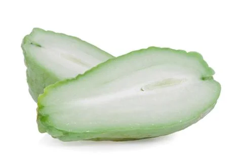 Chayote cut in half showing the pulp or flesh isolated on white background, c Stock Photos