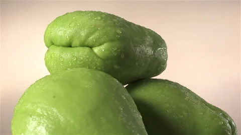 Chayote isolated rotating on beige background Stock Footage 62389606
