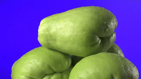 Chayote isolated rotating on blue background Video stock 62391035
