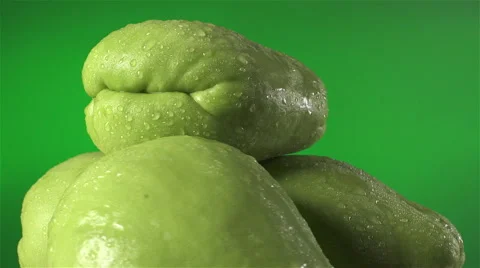 Chayote isolated rotating on green background Stock Footage 62391123