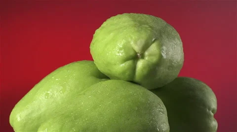 Chayote isolated rotating on red background Stock Footage 62391100
