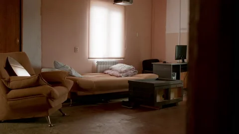 Cheap hotel. Simple room interior. Messy living-room. Stock Footage 142049336
