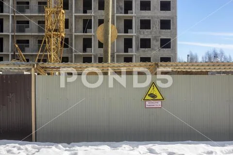 Cheap house under construction and inscription danger, load may fall Stock Photos