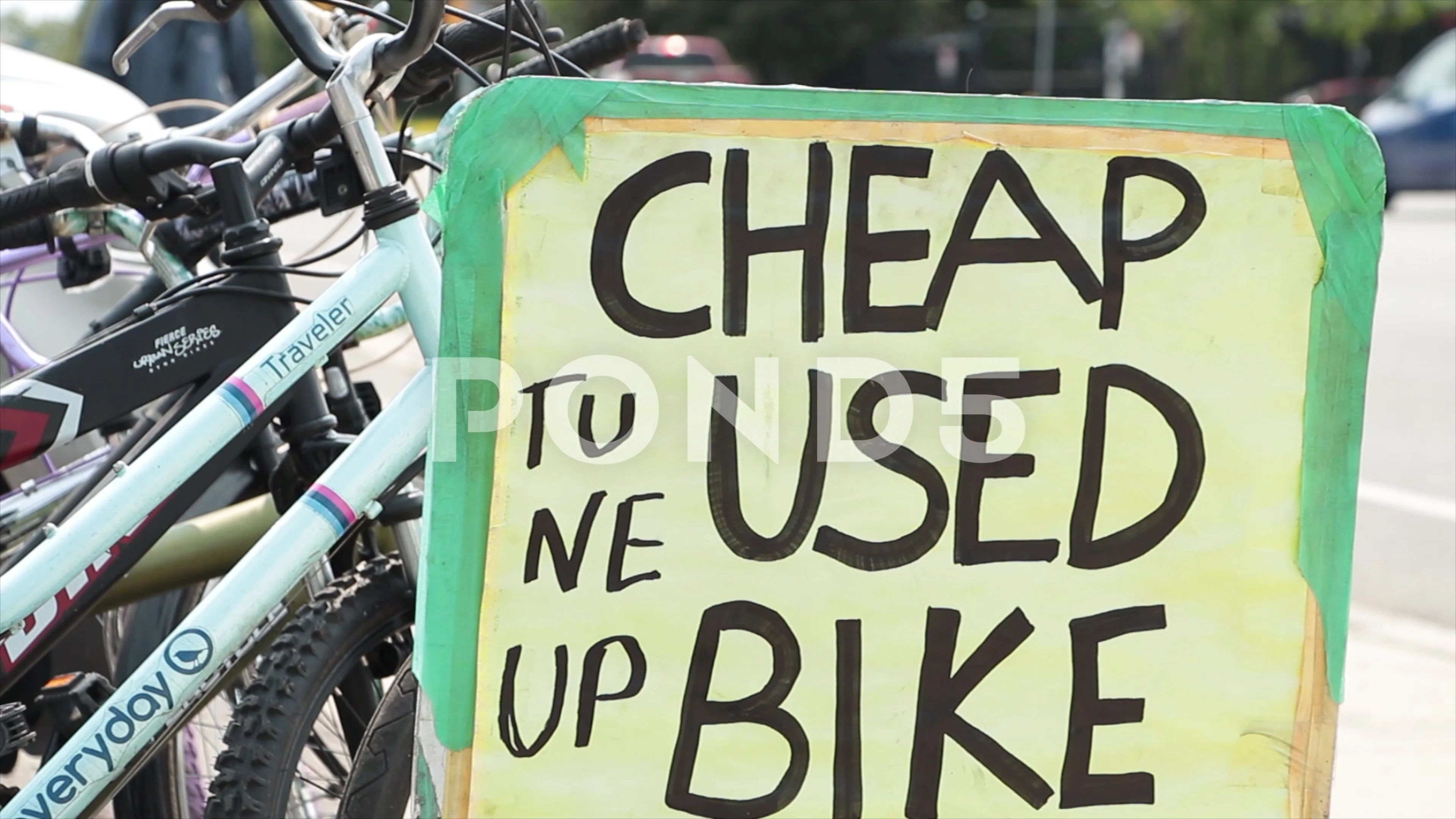 cheap used bike tune up rectangle handwritten in black marker sign with bikes