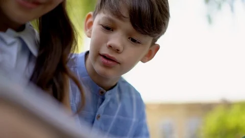 Cheating picking at classmates notes Stock Footage 126730233