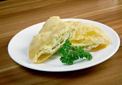 Cheburek  with cheese Stock Photos
