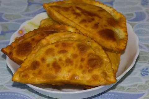 Cheburek plate on the tablecloth 写真素材