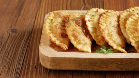Chebureki with sauce. Presentation of the dish. Camera drive along the dish. Stock Footage 147869952