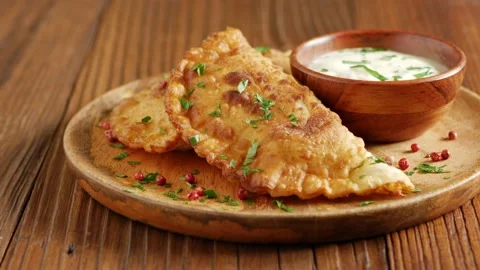 Chebureki with sauce. Presentation of the dish. Stock Footage 147869841