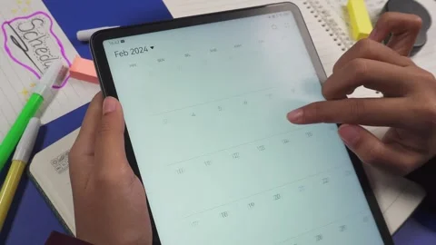 Check activity schedule or date on the tablet screen Stock Footage 276807746