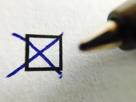 Check - ballpoint pen marking tick in check box Stock Photos