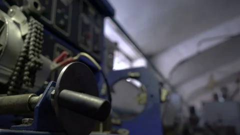 Check the car generator. The worker twists the handle of the test stand Stock Footage 75328443