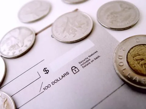 Check with coins Stock Photos