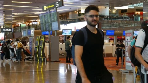 Check-in counters &amp; passengers, Changi Singapore Airport Video stock 110457991
