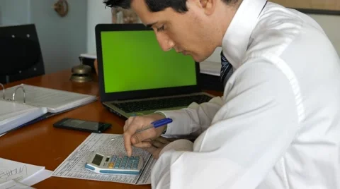 Check the counts with calculator in the background Green screen Stock Footage 60764982