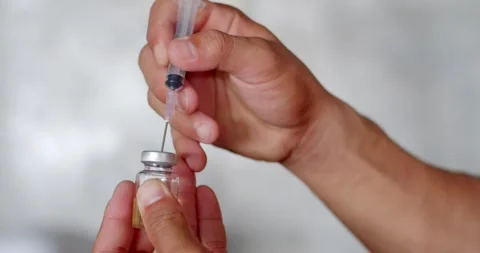 Check the dose in the syringe and remove the air from the syringe. Stock Footage 252273259