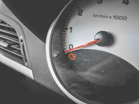 Check engine light on car dashboard close up background Stock Photos