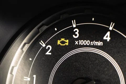 Check Engine Light Closeup on car dashboard Stock Photos