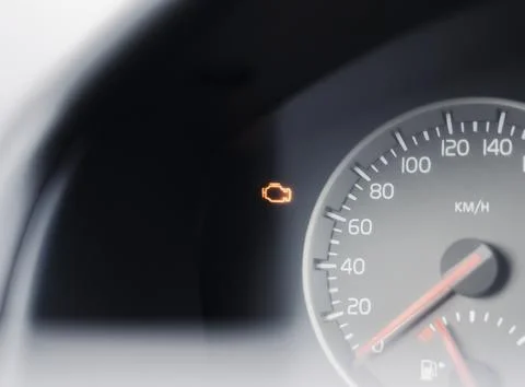 Check engine light flashing on car dashboard after starting the engine Stock Photos