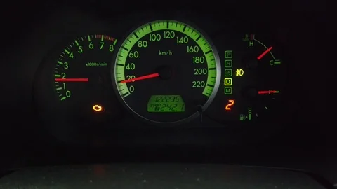 Check the engine light symbol that appears on the dashboard panel Stock Footage 119776007