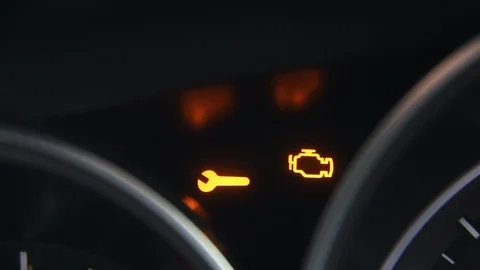 Check engine light symbol that pops up on dashboard when something goes wrong Stock Footage 125624736