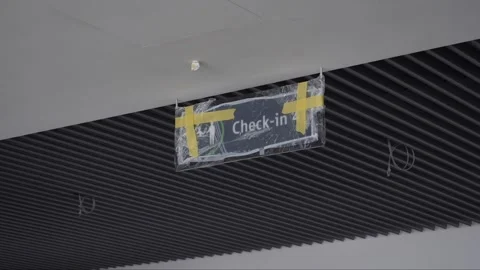 Check-in indicator on the airport terminal ceiling covered in cellophane. Stock Footage 257018452