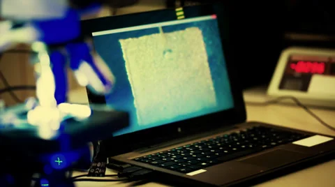 Check micro electronic chip under a microscope Stock Footage 37578222