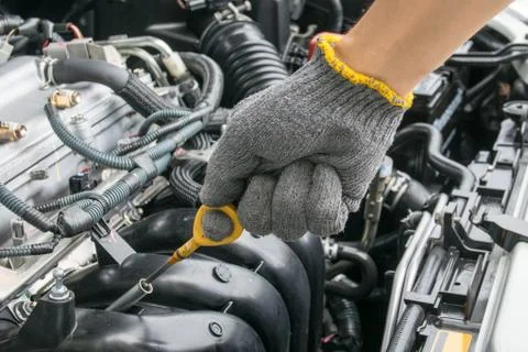 Check the oil level in car engine Stock Photos