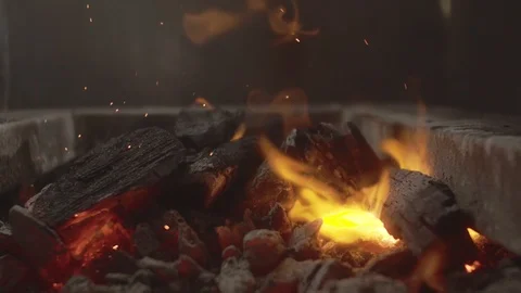 Check out the camera from the bonfire with coals and beautiful yellow sparks Stock Footage 114551706