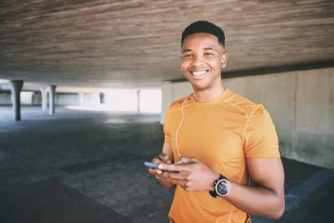 Check out my fitness page on social media. Portrait of a young man using a Stock Photos
