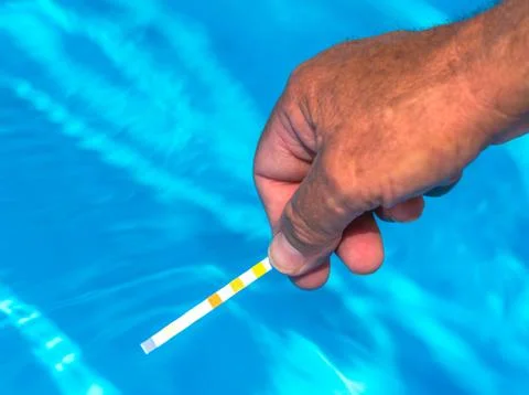 Check the ph of a private swimming pool Stock Photos