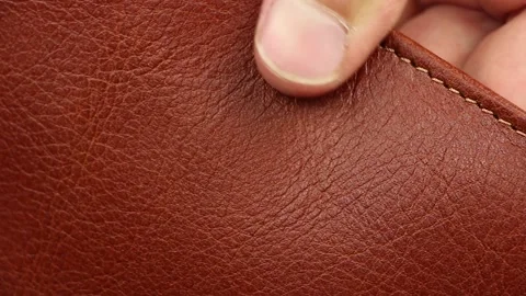 Check quality brown or red natural smooth matt luxury leather, close-up Video stock 145535798